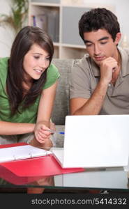 Students doing homework on laptop