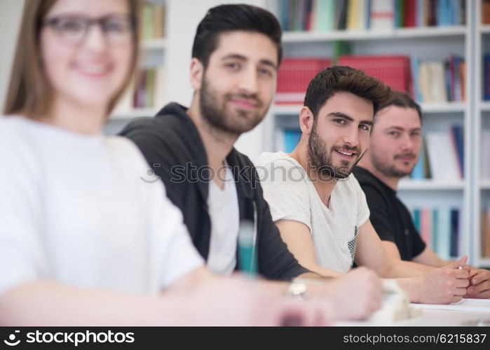 students group study together in school classroom and working together homework project