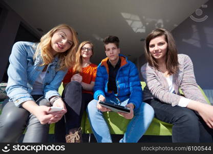 students group working on school project together on tablet computer at modern university