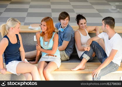 Students have break talking sitting on school bench