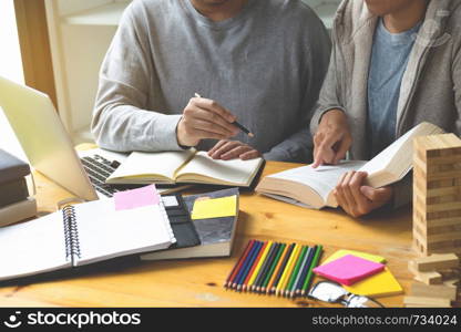 Students helps friend teaching and learning subject additional in library. Education concept.