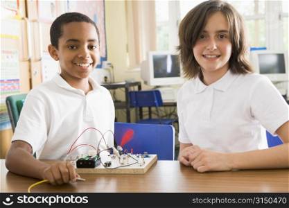 Students in class with electronic project