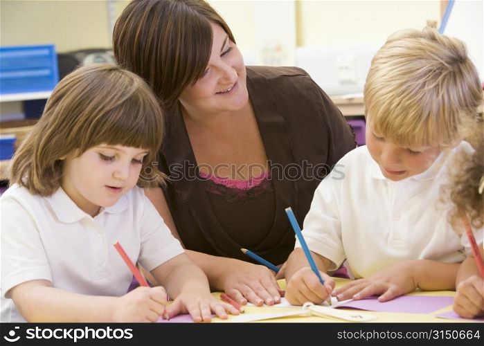 Students in class with teacher drawing (selective focus)