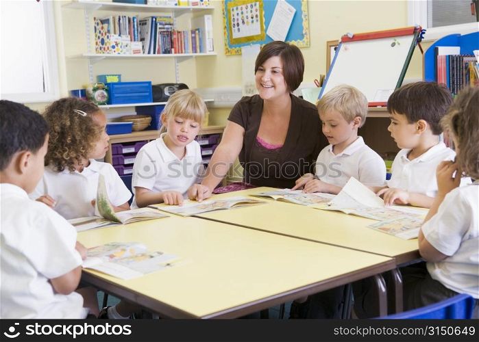 Students in class with teacher reading
