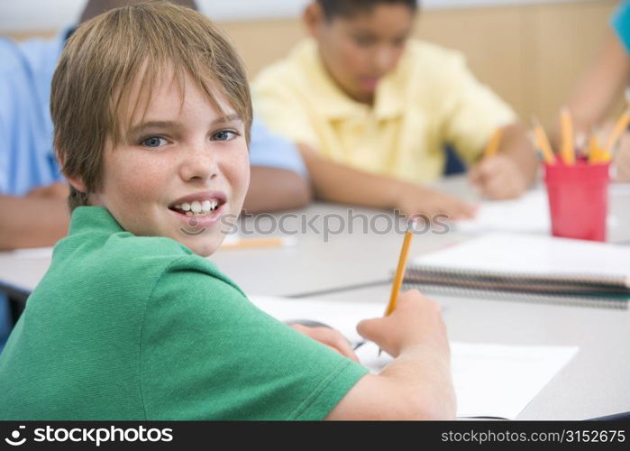 Students in class writing (selective focus)