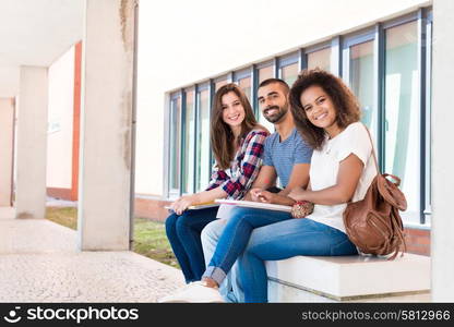 Students sharing notes in the university campus