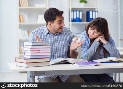 Students sitting and studying in classroom college