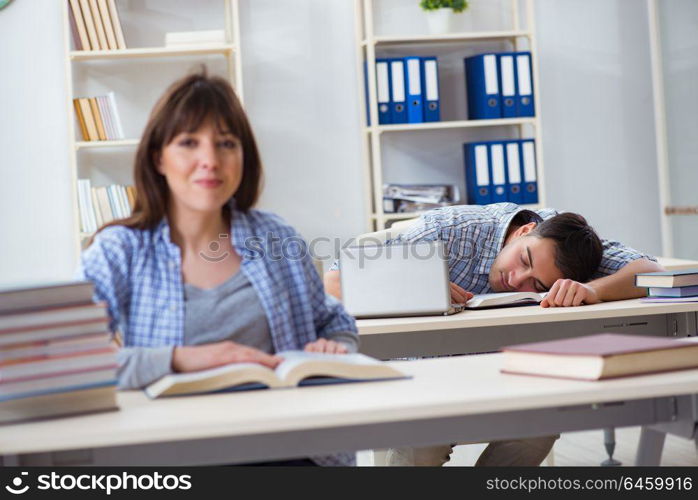 Students sitting and studying in classroom college