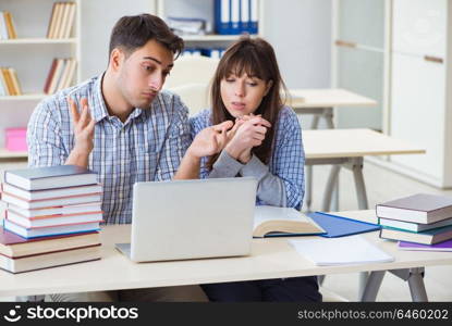 Students sitting and studying in classroom college