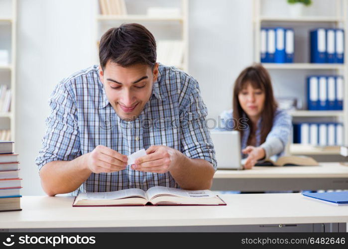 Students sitting and studying in classroom college