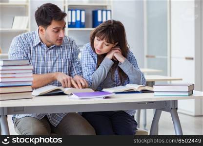 Students sitting and studying in classroom college