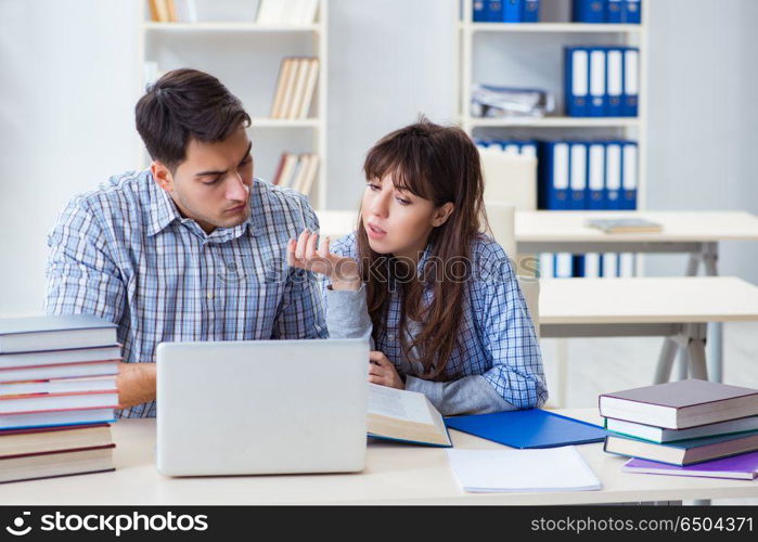 Students sitting and studying in classroom college