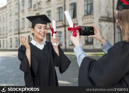 students taking each other graduation
