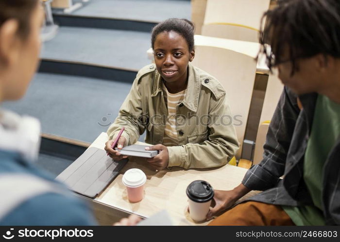 students talking after class