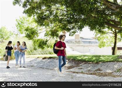 students walking near greenery