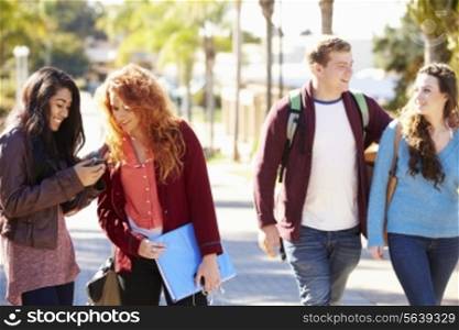 Students Walking Outdoors On University Campus