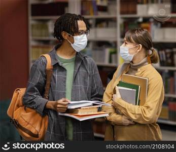 students wearing medical masks library