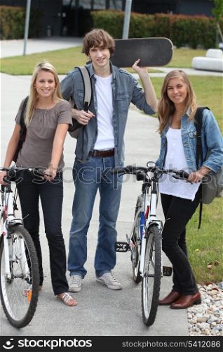 students with bikes and skateboard