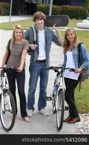students with bikes and skateboard