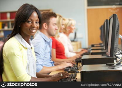 Students working on computers in library