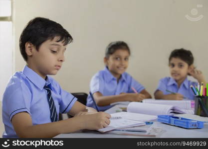 students writing in their notebooks in class