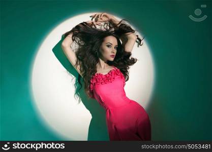 Studio art fashion photo of beautiful sexy yong woman in beam of searchlight