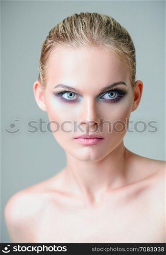 Studio beauty shot: closeup portrait of a lovely young girl