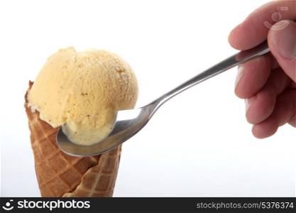 Studio closeup of vanilla ice cream cone