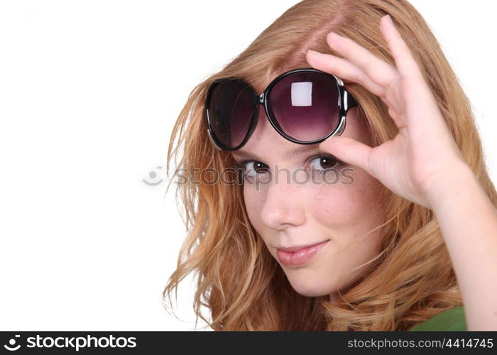 Studio closeup of young beautiful redhead