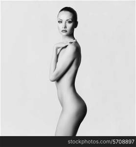 Studio fashion photo of elegant naked lady