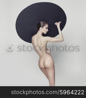 Studio fashion photo of nude fitness woman. Perfect body. Health and beauty