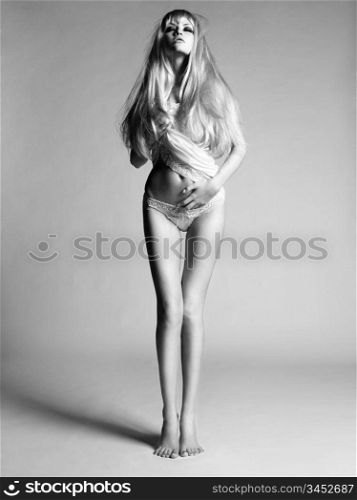 Studio fashion photo of sensual blonde lady