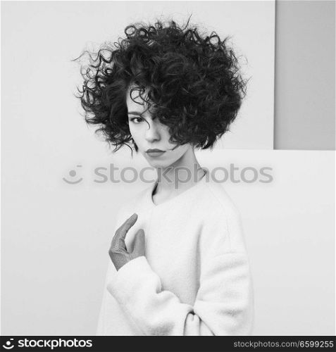 Studio fashion portrait of beautiful asian woman in white coat on gray background. Stylish look book. Autumn Winter season. 