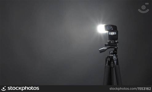 Studio light and back drop and soft box set up for shooting photo or video production which includes flashlight and continue lighting on tripod and paper background and used for photographer or videographer