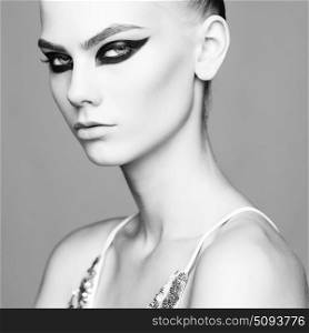 Studio photo of elegant lady with color smoky eyes makeup. Young woman with very beautiful eyes. Elegant lady with art makeup and with fashionable makeup