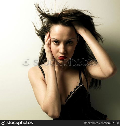 Studio photo of magnificent young woman in corset