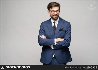 studio photo of young caucasian handsome businessman wearing suit. studio photo of young handsome businessman wearing suit