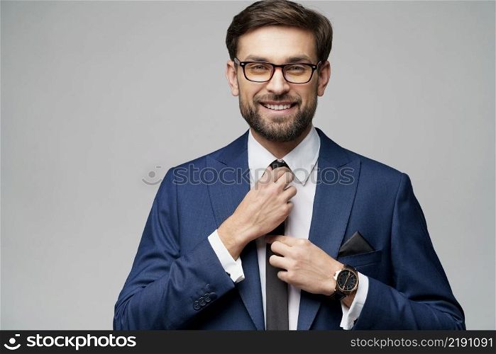 studio photo of young caucasian handsome stylish businessman wearing suit. studio photo of young handsome stylish businessman wearing suit
