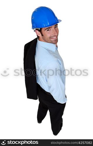 studio picture of handsome architect with hard hat