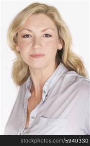 Studio portrait headshot of attractive happy middle aged blond woman in her forties