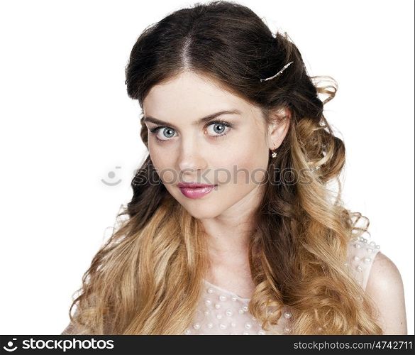 Studio portrait of a beautiful blonde close up with bright makeup on a white background isolated