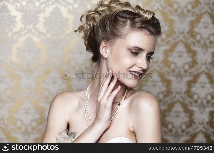 Studio portrait of a beautiful girl in the image of the bride