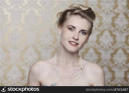 Studio portrait of a beautiful girl in the image of the bride