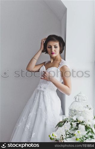 Studio portrait of a beautiful girl in the Studio.. Portrait of beautiful girl in wedding dress in Studio 6467.