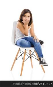 Studio portrait of a beautiful young girl sitting on a chair sending a kiss