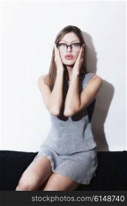 Studio portrait of a beautiful young girl wearing eyeglasses