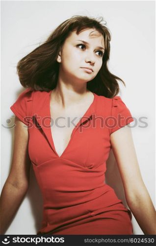 Studio portrait of a beautiful young woman on white background.