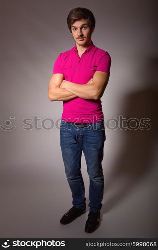 Studio portrait of a handsome young man, full lenght