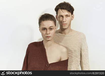 Studio portrait of a young man and woman on a white background