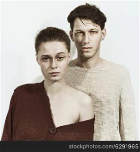 Studio portrait of a young man and woman on a white background